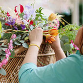 Designer creating floral bouquet.